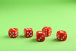 © New Africa - Many red game dices on green background