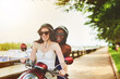 © peopleimages.com - Female couple, motor scooter and smile outside with laugh for fun in summer on vacation or holiday. Lesbian, lgbtq and diverse with women in nature or tourist in France with cheerful and sunshine.