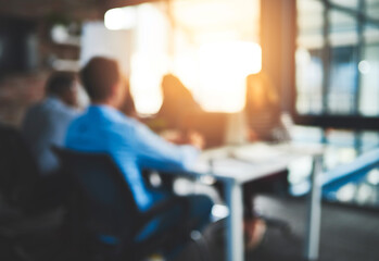 Meeting, boardroom and teamwork in office, blurred and lens flare in workplace. Planning, employee and conversation for colleagues and design for creative agency, group or business people