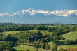 Countryside landscape in the Gers department in southwestern France with the Pyrenees mountains in the background