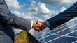 Before a solar panel unit, company delegates join hands, representing partnerships nurtured for sustainability causes. Corporate carbon reduction