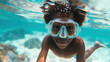 a cheerful afro american boy swimming underwater in a mask. Summer vacation.