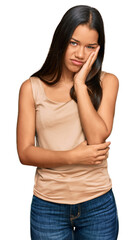 Sticker - Beautiful hispanic woman wearing casual clothes thinking looking tired and bored with depression problems with crossed arms.