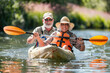 © Ekaterina Pokrovsky - Senior couple kayaking on the river. Healthy elders enjoying summer day outdoors. Sportive people having fun at the nature. Active retirement concept