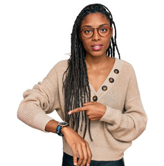 Wall Mural - African american woman wearing casual clothes in hurry pointing to watch time, impatience, upset and angry for deadline delay