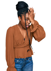 Canvas Print - Young african american woman wearing casual clothes surprised with hand on head for mistake, remember error. forgot, bad memory concept.