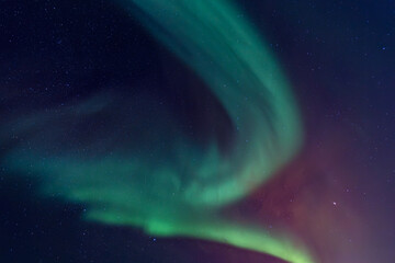 aurora borealis in green, red and purple as background