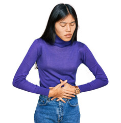 Sticker - Beautiful young asian woman wearing casual clothes with hand on stomach because indigestion, painful illness feeling unwell. ache concept.