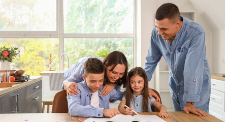 Poster - Little children with their parents doing homework in kitchen