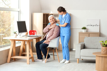 Canvas Print - Happy senior man with nurse at home