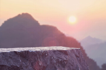 Poster - Empty top of stone surface with blurred mountain background at sunset. Ideal for serene product display and nature themed presentation concept.