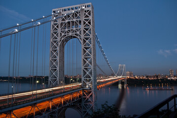 Wall Mural - Twilight glow on city suspension bridge