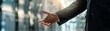 © kitidach - Design an image of a dynamic male CEO, wearing a black suit, torso in view, orchestrating a meeting with a welcoming gesture