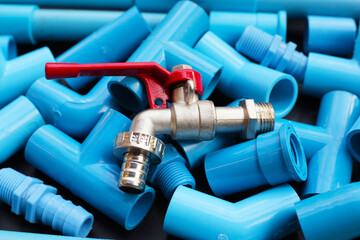 Wall Mural - Plumber equipment with blue pvc pipe connections for plumbing work.