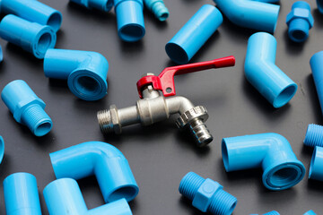 Wall Mural - Plumber equipment with blue pvc pipe connections for plumbing work.