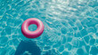 Top view of pink inflatable swim ring in blue water in pool on sunny day, Summer holiday concept. Generative AI