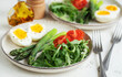 Fresh Spring Salad With Boiled Eggs, Asparagus, and Tomatoes on a Bright Day