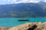 Fototapeta  - stunning Swiss Alpine Lake at Interlaken, Switzerland, crystal clear aquarium lake, emerald green and blue lake, pure and crystal-clear water, water spots to go for a swim, float or dive, lake pool