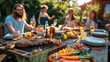A group of friends having a barbecue in a backyard, with a variety of grilled meats and vegetables on the table