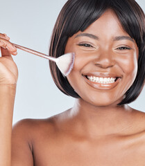 African woman, makeup brush and portrait in studio with smile, beauty and foundation by background. Girl, person and happy with tools, cosmetics and product for facial skin with powder for aesthetic