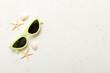 sunglasses with seashell lying on table background. Sunglasses on summer background. Top view flat lay with copy space for text