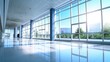 © photolas - Interior of a large glazed modern office building, business center on a bright sunny day. Large windows show blue sky on a sunny day.