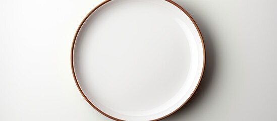 Poster - A plate with no food on it placed alone on a blank white background leaving space for the image. Creative banner. Copyspace image