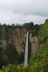 Wall Mural - Sipisopiso waterfall at Tonging Village dropping to lake Toba, North Sumatra, Indonesia