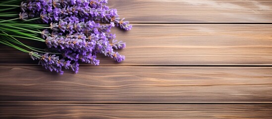 Sticker - A top down view of fresh lavender bouquet with wood as the background creates a captivating copy space image