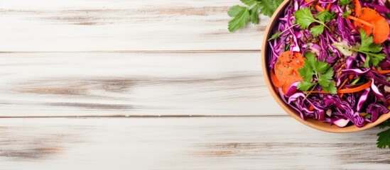 Poster - Top view of a detox salad made with red cabbage carrots and pomegranate accompanied by a flavorful cilantro dressing Presented on a white wooden background with ample space for copy