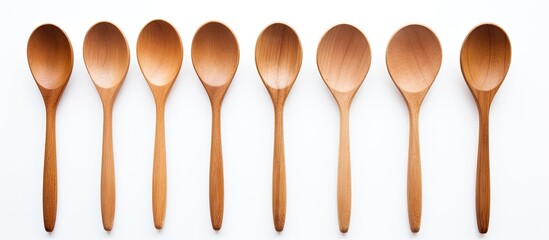 Aufkleber - A simple and clean image showcasing wooden spoons on a white background with plenty of copy space