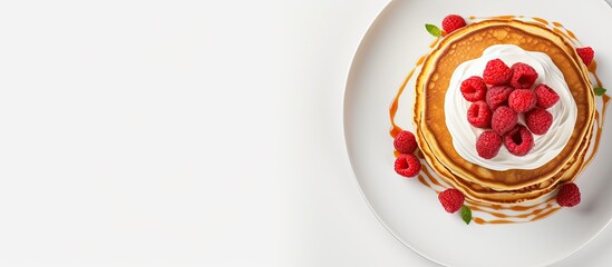 Poster - Top view of fluffy pancakes topped with fresh raspberries presented on a white ceramic plate with ample copy space image