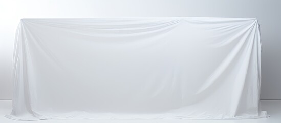 Wall Mural - A white plastic cover stands alone on a white background providing ample space for further additions or text