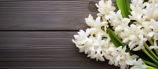 Poster - White hyacinths in a bouquet placed on a weathered wood background create a visually captivating copy space image