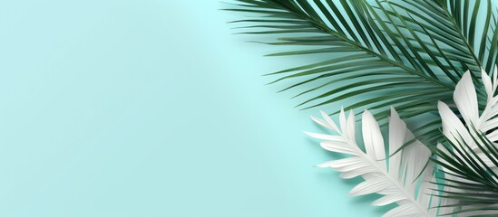 Fototapete - Top view of a summer themed flat lay with white palm leaves on a refreshing mint background The composition evokes the essence of summer offering a copy space image