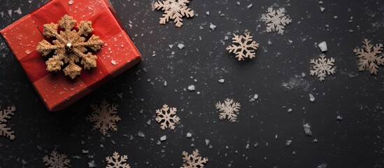 Poster - An aerial snapshot of a Christmas gift box decorated with snowflakes captured from above with a flat perspective There is ample copy space in the image