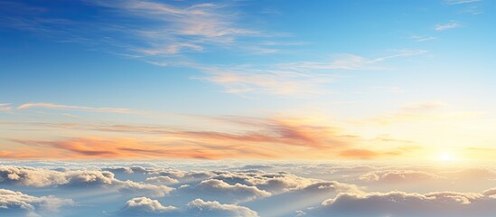 Fototapete - In the morning there is a breathtaking natural background featuring a picturesque sunrise a clear blue sky and a cluster of fluffy white clouds Perfect for copy space image