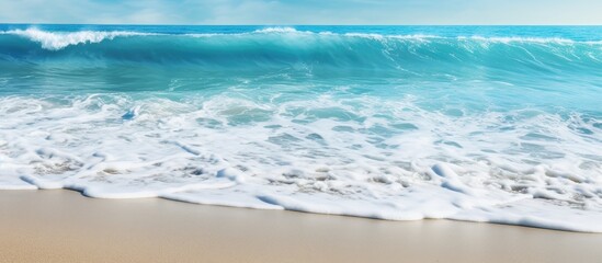 Poster - A close up image of the sea coast showcasing the texture and background of the sand and water providing ample copy space