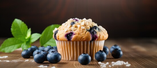 Poster - A delicious blueberry muffin made with oats is displayed on a wooden background ready to be baked The image provides ample space for copy