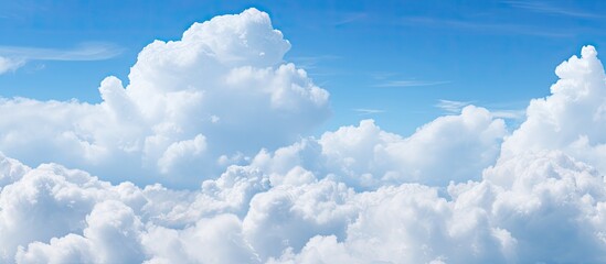Aufkleber - A copy space image of fluffy white clouds against a vivid blue sky