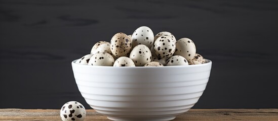Aufkleber - White bowl with quail eggs offering a perfect copy space image