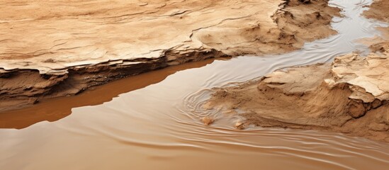 Poster - A brown slit of mud was shifted beneath the water s surface in the river creating a copy space image