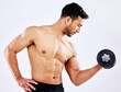 © peopleimages.com - Muscular man, fitness and weightlifting with dumbbell for workout, strength or muscle gain on a gray studio background. Profile of young male person or active bodybuilder with bicep curl for exercise