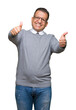 © Krakenimages.com - Middle age bussines arab man wearing glasses over isolated background approving doing positive gesture with hand, thumbs up smiling and happy for success. Looking at the camera, winner gesture.