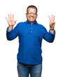 © Krakenimages.com - Middle age arab man wearing glasses over isolated background showing and pointing up with fingers number eight while smiling confident and happy.