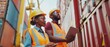 © Антон Сальников - In the container terminal, a multi-ethnic female industrial engineer with a tablet and a black African American supervisor, both in hard hats and safety vests, talk about logistics operations with