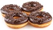 chocolate doughnuts adorned with various chocolate varieties, featuring a clean and smooth chocolate glaze against a pristine white background.
