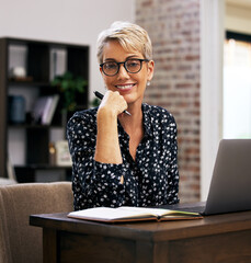 Poster - Portrait, laptop and mature woman in home office with notebook at desk for article, post update or remote work in living room. Happiness, journalist and person for web report, news or freelancer