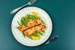 Baked salmon fillets with green or bush beans.