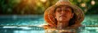 A woman wearing a sunhat is swimming in the water and enjoying the sun